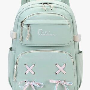 Mint green backpack filled with back to school supplies (See description)